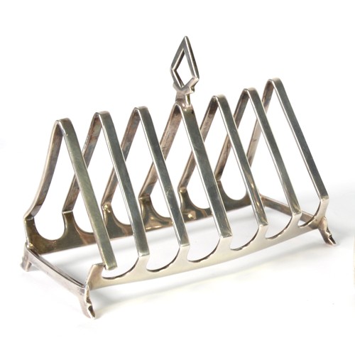 369 - SILVER ART DECO SIX DIVISION TOAST RACK, with seven triangular dividers, one with diamond shaped han... 