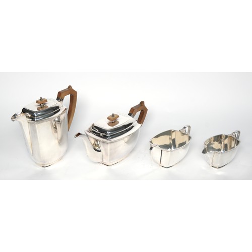 547 - FOUR PIECE ART DECO ELECTROPLATED TEA SET, of oblong form with flat hanged covers, angular brown han... 