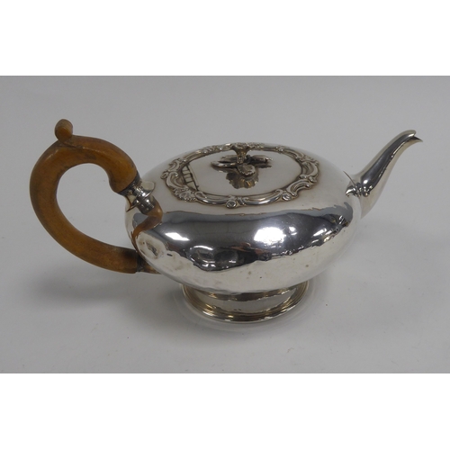 455 - WILLIAM IV SILVER TEAPOT of compressed baluster shape, the flat cover with flower finial framed with... 