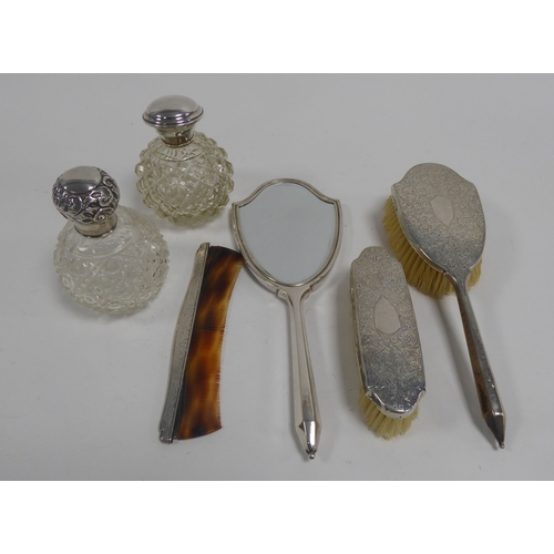 456 - TWO SIMILAR EARLY TWENTIETH CENTURY ORBICULAR CUT GLASS SILVER-TOPPED PERFUME BOTTLES, respectively ... 