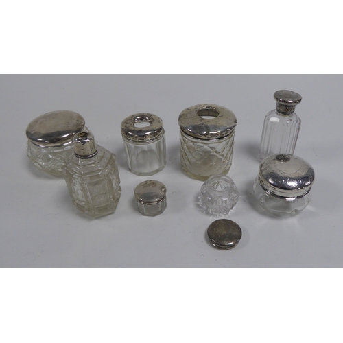 479 - COLLECTION OF SEVEN GLASS DRESSING TABKLE JARS AND BOTTLES WITH SILVER COVERS, 2.05ozt of weighable ... 