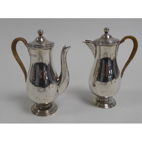 494 - EDWARD VII SILVER SMALL CAFÉ AU LAIT SET BY FAIRPOINT BROTHERS, each of slender pedestal baluster fo... 