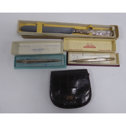 502 - EDWARD VII SILVER MOUNTED CROCODILE SKIN WALLET, together with a BOXED CAKE KNIFE WITH FILLED SILVER... 