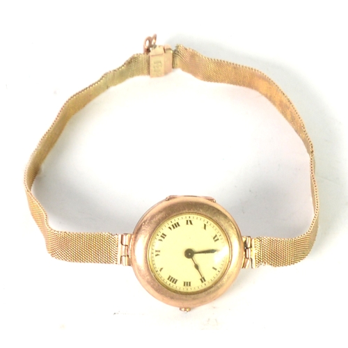 81 - LADY'S BUREN WRISTWATCH in 9ct GOLD CASE, circular roman dial and the 9ct GOLD MESH BRACELET, 25.8gm... 