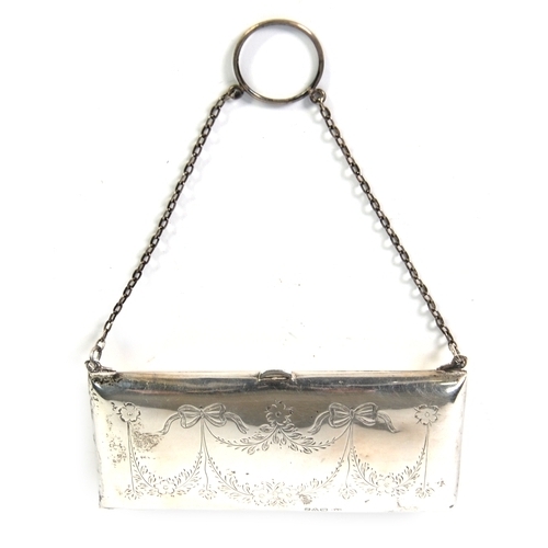 497 - GEORGE V ENGRAVED SILVER EVENING PURSE, of oblong form with tan leather interior and chain handle, d... 