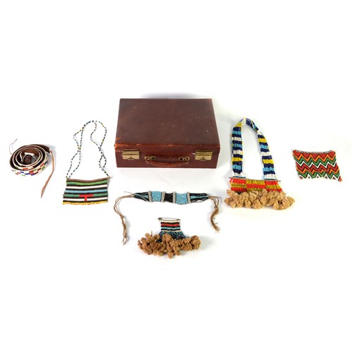 336 - MASAI, AFRICAN MICRO-BEAD DECORATED ITEMS comprising a leather belt, 36in (91.4cm) long; 14 strand n... 