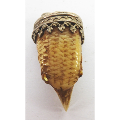 65 - VICTORIAN CARVED BIRD CLAW PENDANT, carved as the head of a bird with tiny glass eyes, with intricat... 