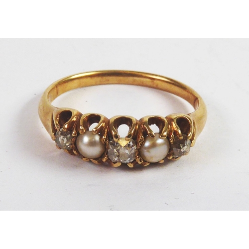 92 - GOLD COLOURED METAL RING, set with three small diamonds and two seed pearls, ring size I, 2.2gms