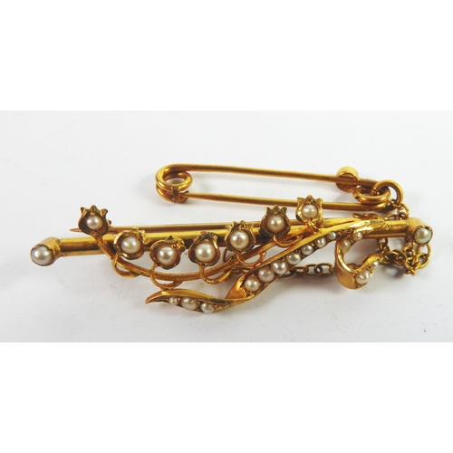 95 - VICTORIAN GOLD COLOURED METAL (UNMARKED) BAR BROOCH with seed pearl to each end and overlaid with a ... 