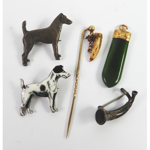 108 - ENAMELLED METAL BLACK AND WHITE DOG BROOCH; a metal dog BROOCH; a small hunting horn BROOCH; a JADE ... 