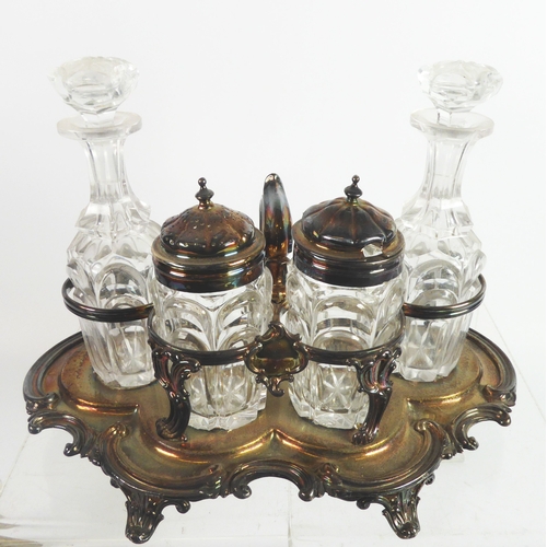 287 - LATE VICTORIAN FOUR BOTTLE CRUET FRAME, of shaped oval form with C scroll border, shell capped tab f... 