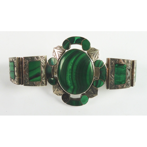 86 - VICTORIAN ENGRAVED SILVER COLOURED METAL (UNMARKED) AND MALACHITE BRACELET, the large oval top flank... 