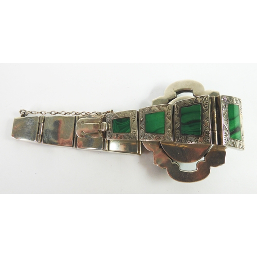 86 - VICTORIAN ENGRAVED SILVER COLOURED METAL (UNMARKED) AND MALACHITE BRACELET, the large oval top flank... 