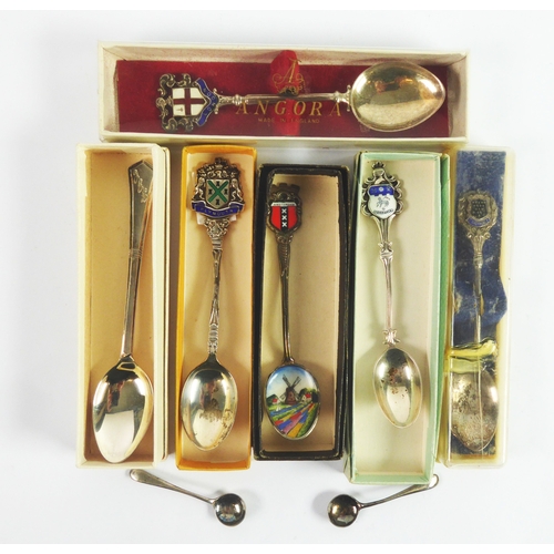 231 - FOUR BOXED SILVER SOUVENIR TEASPOONS WITH ENAMELLED TOPS, ANOTHER IN ELECTROPLATE, a SILVER TEASPOON... 