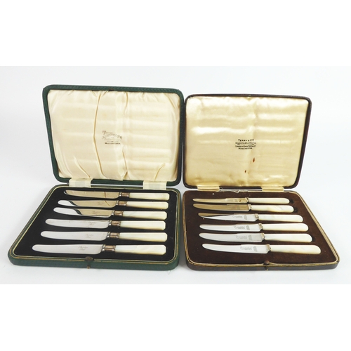 303 - TWO CASED SETS OF SIX STAINLESS STEEL AFTERNOON TEA KNIVES WITH MOTHER OF PEARL HANDLES, (2)