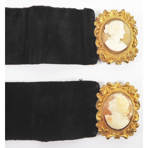 189 - PAIR OF VICTORIAN BROAD BLACK VELVET BRACELETS, each with a gold plated large rococo clasp set with ... 