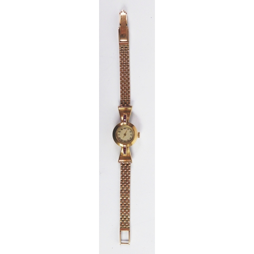 2 - GOLD WRISTWATCH: Mid-twentieth century lady’s ruby set 9 ct gold wristwatch with integrated multi-li... 