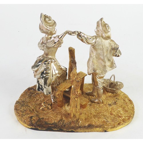 218 - MAPPIN & WEBB PARCEL GILT SILVER FIGURAL GROUP depicting a gallant helping a crinolined lady cli... 