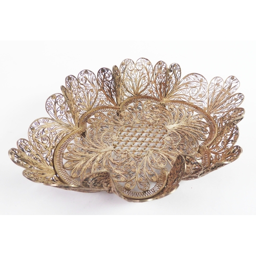 208 - INTRICATE FILIGREE SILVER COLOURED METAL SCOLLOPED OVAL DISH, 5 3/4in (14.5cm) long, 1 3/4oz (tests ... 