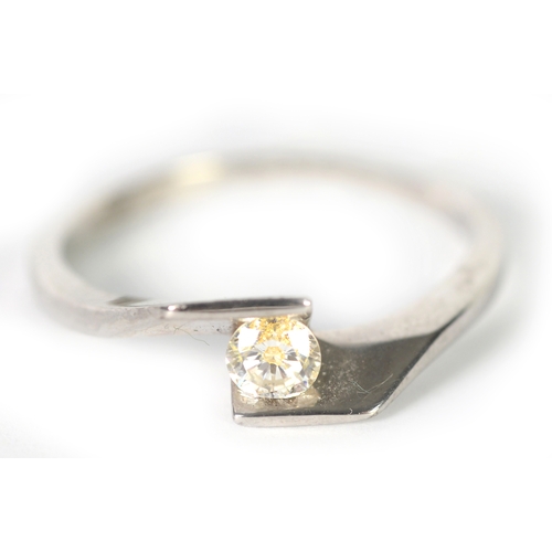 168 - 18ct WHITE GOLD RING, the crossover top set with a round brilliant cut solitaire diamond, approximat... 