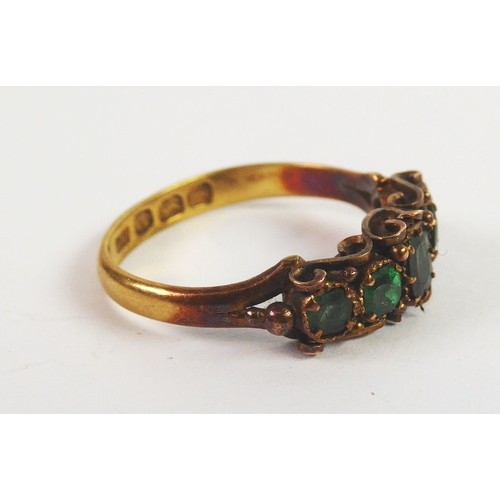 114 - GEORGE IV RING, claw set with five emeralds, graduating from the centre, the sides of the setting em... 