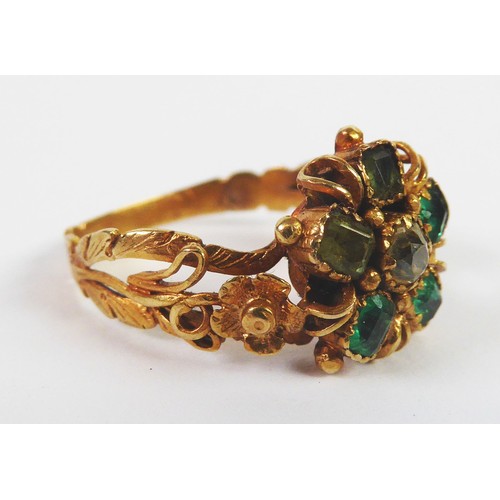 118 - VICTORIAN GOLD COLOURED METAL DAISY CLUSTER RING set with a centre small, old cut diamond and a peta... 