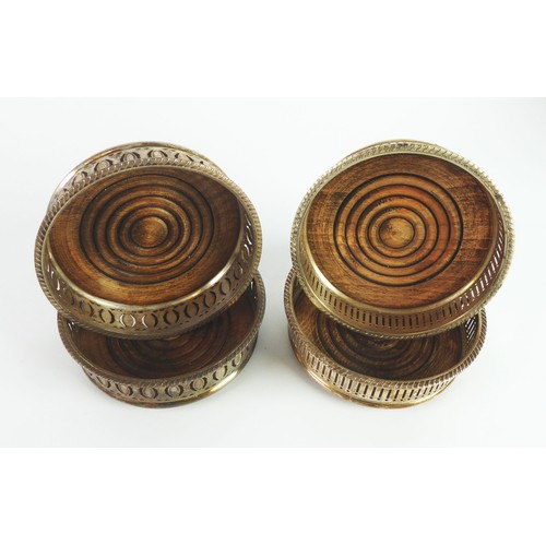 18 - WINE COASTERS: Two pairs of silver plated wine coasters with stained beech bases [4]