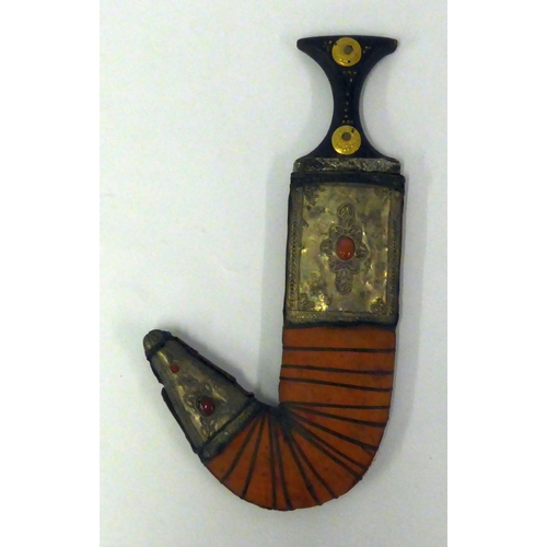 88 - EARLY TWENTIETH CENTURY ARABIAN JAMBIYA (DAGGER), the bound ANIMAL HIDE covered sheath mounted with ... 