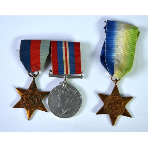 82 - THREE WORLD WAR II SERVICE MEDALS, comprising an Atlantic Star, a 1939-1945 Star and a 1939-1945 War... 