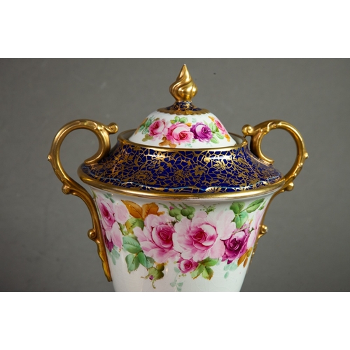 124 - ADDERLEYS TWO HANDLED CHINA VASE AND COVER, of footed form with gilt scroll handles and flame finial... 