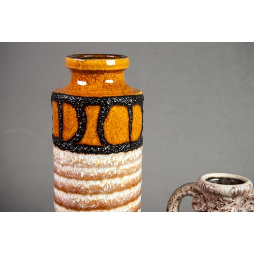 17 - STYLISH WEST GERMAN CYLINDRICAL POTERY VASE, glazed in mottled brown and with fat lava borders, 10 ½... 