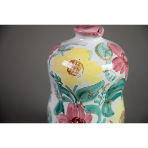 34 - LEO ENNA, DENMARK, HAND PAINTED FAIENCE POTTERY FLASK AND STOPPER, decorated in colours with flowers... 