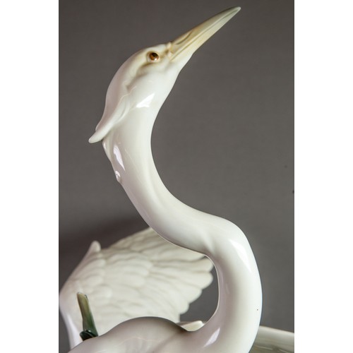 149 - LARGE LLADRO-SPAIN PORCELAIN GROUP DEPICTING TWO CRANES possibly in a courtship dance, one with wing... 