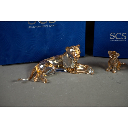 195 - TWO BOXED SWAROVSKI GLASS MODELS OF LIONS, comprising: ANNUAL EDITION 2016, ‘LION AKILI’, 5” (12.7cm... 