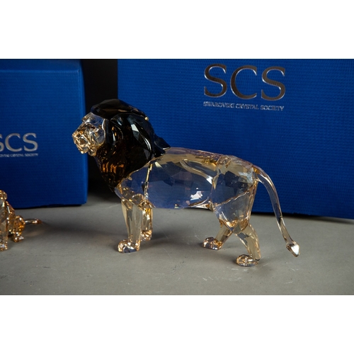 195 - TWO BOXED SWAROVSKI GLASS MODELS OF LIONS, comprising: ANNUAL EDITION 2016, ‘LION AKILI’, 5” (12.7cm... 