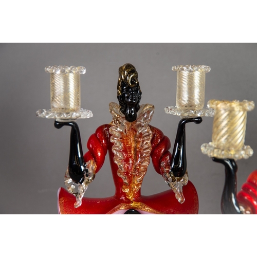 215 - PAIR OF MURANO RED, BLACK AND AVENTURINE GLASS FIGURAL TWIN LIGHT CANDLE HOLDERS, each modelled in k... 