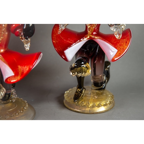 215 - PAIR OF MURANO RED, BLACK AND AVENTURINE GLASS FIGURAL TWIN LIGHT CANDLE HOLDERS, each modelled in k... 