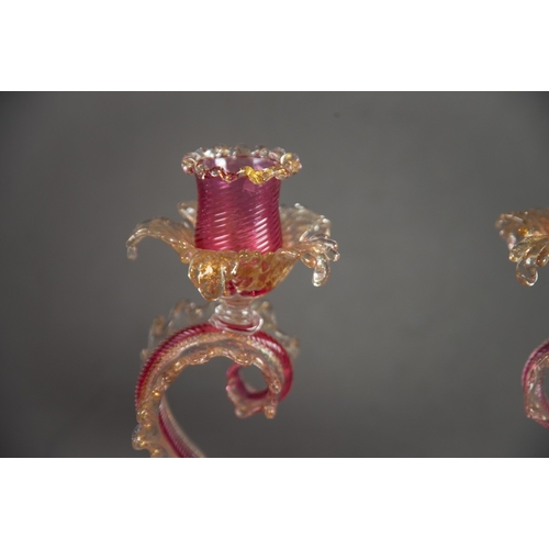 223 - PAIR OF MURANO PINK AND AVENTURINE GLASS CANDLE HOLDERS, each modelled as a scrolled leaf supporting... 