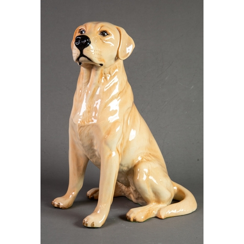 65 - PROBABLY BESWICK, POTTERY MODEL OF A SEATED LABRADOR, 13” (33cm) high, green baize stuck to the base... 