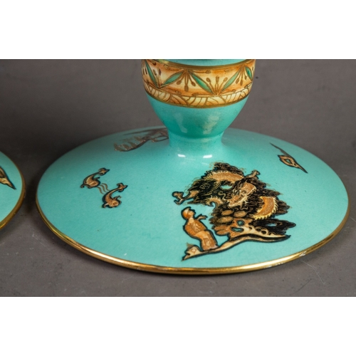 3 - PAIR OF CARLTON WARE SQUAT CANDLE HOLDERS, with turquoise ground, the campana shaped sconce with bro... 