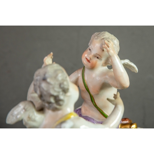 154 - 19th CENTURY MEISSEN PORCELAIN GROUP OF TWO CHERUBS, each seated on the rococo embossed white base, ... 