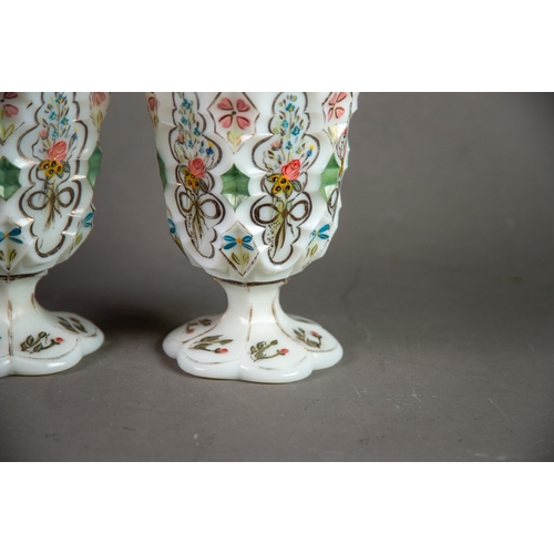 210 - PAIR OF NINETEENTH CENTURY HAND PAINTED AND MOULDED MILK GLASS GOBLETS, each of typical form with pe... 