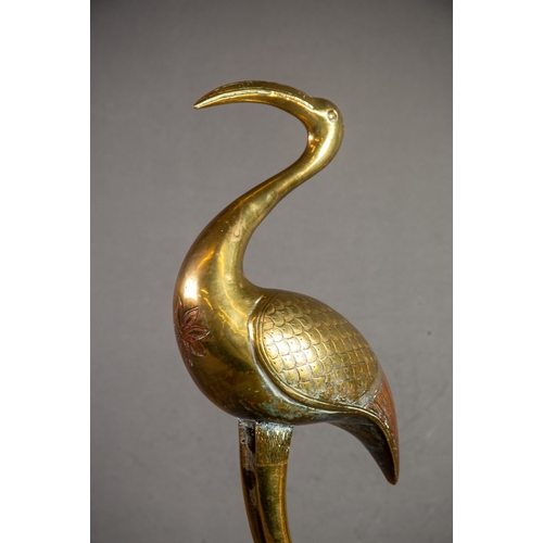 171 - BENARES BRASS MODEL OF A STORK, on a circular base, 18” (45.7cm) high