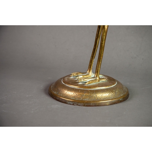 171 - BENARES BRASS MODEL OF A STORK, on a circular base, 18” (45.7cm) high