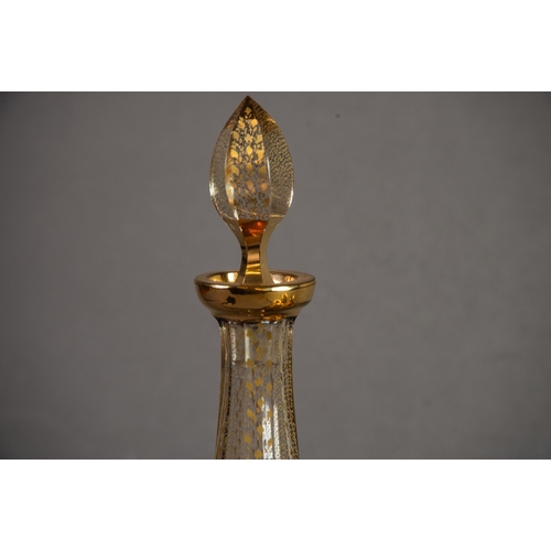 235 - BOHEMIAN RUBY OVERLAID AND GILT DECORATED CUT GLASS SLENDER CONICAL LIQUEUR DECANTER AND STOPPER, 11... 