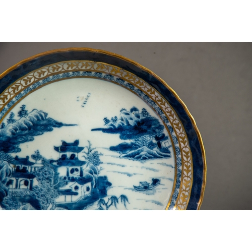 179 - NINETEENTH CENTURY CHINESE BLUE AND WHITE PORCELAIN SAUCER DISH, painted with dwellings, trees and r... 