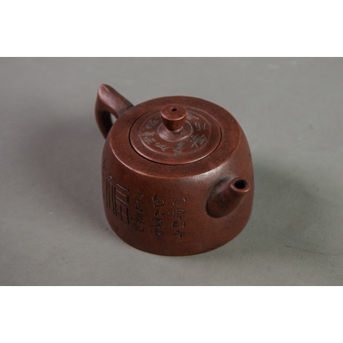 180 - CHINESE YIXING RED POTTERY MINIATURE TEAPOT, incised with character marks, 2 ½” (6.3cm) high, impres... 