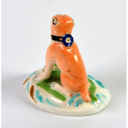 85 - NINETEENTH CENTURY DERBY PORCELAIN MODEL OF A SEATED PUG, painted in colours and gilt, on a moulded ... 