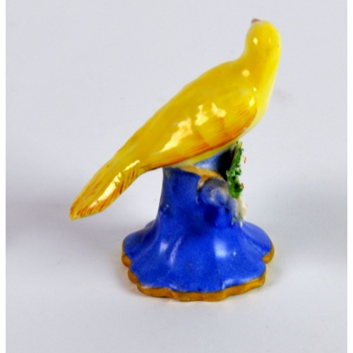 89 - CHAMBERLAIN’S WORCESTER PORCELAIN MODEL OF A YELLOW BIRD, painted In colours and modelled perched on... 