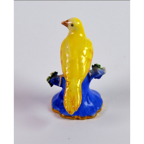 89 - CHAMBERLAIN’S WORCESTER PORCELAIN MODEL OF A YELLOW BIRD, painted In colours and modelled perched on... 